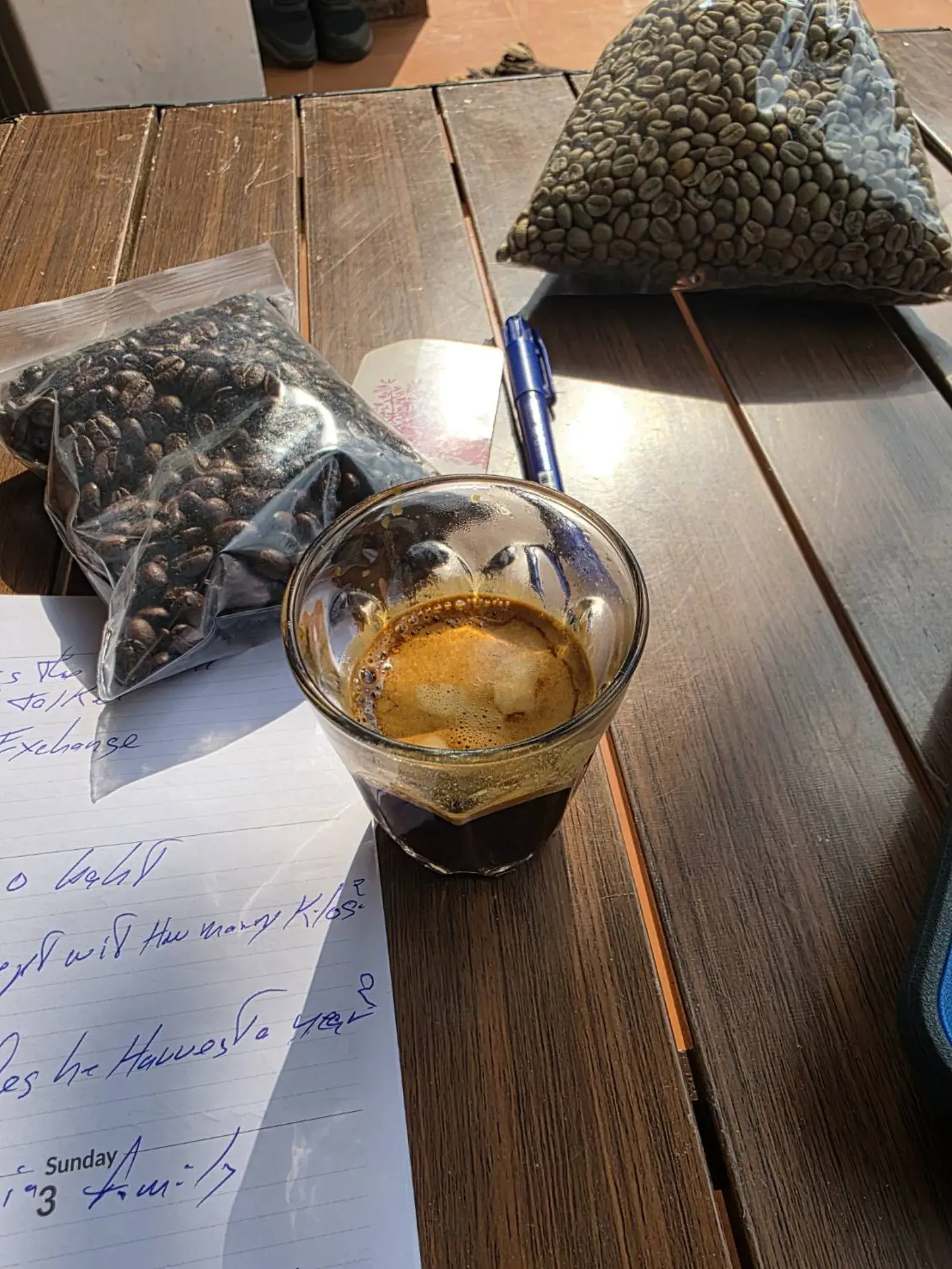 Coffee beans and a freshly brewed cup